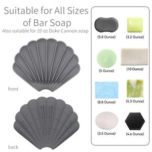 Grey shell-shaped silicone soap dish with non-slip drainage design for bathrooms