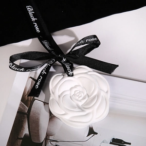 White rose shaped plaster aromatherapy diffuser stone with elegant black ribbon