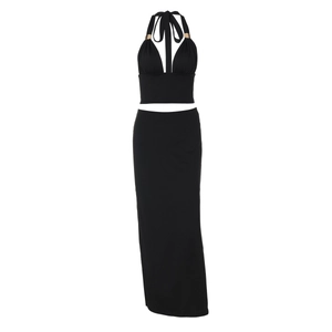 Detail of black halter crop top and high waist maxi skirt set with soft fabric texture