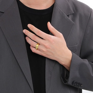 Men's vintage golden stainless steel spinning ring with Viking runes on hand