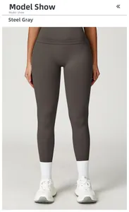 Front view of steel grey high-waisted seamless yoga pants with white sneakers and socks