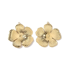 Detailed view of two gold-toned 3D daisy flower pendants with textured metal petals