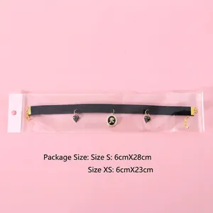 Black velvet pet choker with gold floral relief pendant and adjustable metal chain