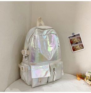 Detail of laser PU backpack featuring holographic finish and adjustable side buckles