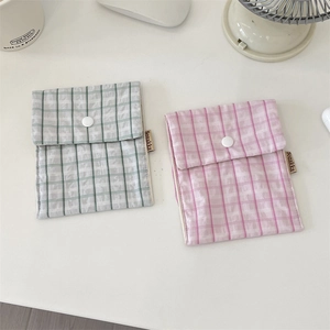 Floral plaid sanitary napkin storage pouch with metal snap button and brand label