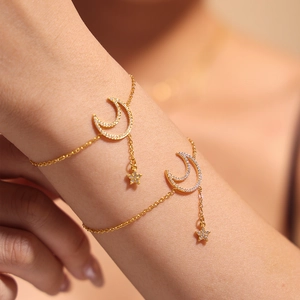 Elegant gold celestial bracelet with sparkling moon and star zircon charms for women