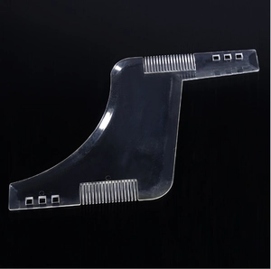 Transparent beard shaping template with curved edge on professional black background