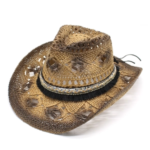Vintage dark brown hollow straw cowboy hat with colorful beaded band and fringe detail