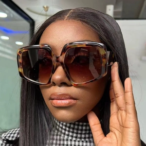 Women's vintage oversized square sunglasses with tortoise frame and brown gradient lenses