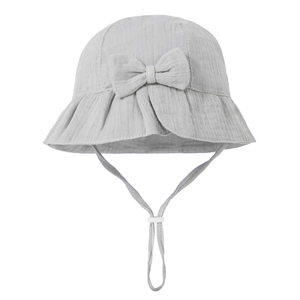 Detail of grey cotton baby sun hat featuring a large bow and adjustable chin strap