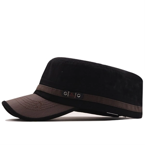 Detail of army cap with black fabric crown and brown leather brim with star embroidery