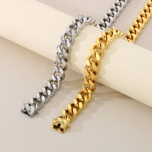 13mm hip-hop Cuban link bracelets in gold and silver steel on a display stand