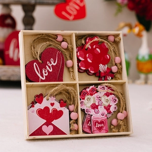 Detailed view of pink wooden Valentine heart ornaments in a four-compartment storage box