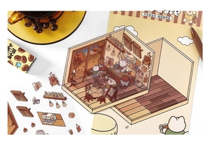 Detail of 3D miniature paper model kit featuring a cozy cat cafe scene for DIY scrapbooking