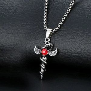 Gothic pendant with silver wings, cross sword, and red gem on black leather background