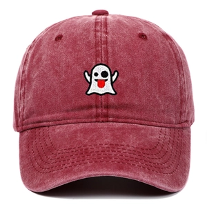 Close-up of cute white ghost embroidery on a washed red cotton baseball cap