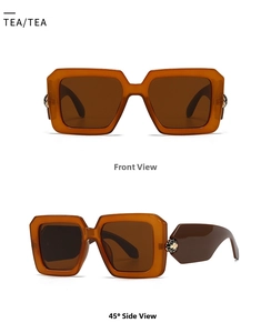 Detail view of tortoiseshell rectangle sunglasses with honeycomb metal decoration