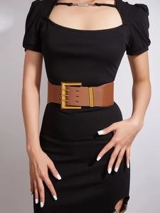 Detail of a brown elastic corset belt with a gold-tone square buckle and PU leather finish