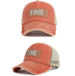 Detailed macro view of vintage washed baseball cap with frayed edges and mesh back
