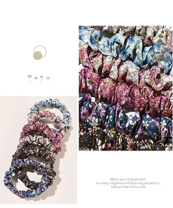 Detailed view of floral scrunchies fabric texture and assorted patterns in a set