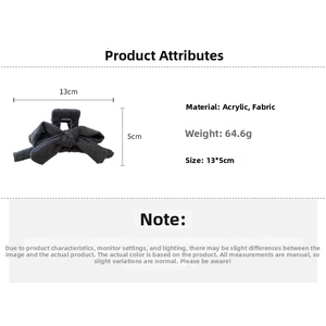 Detailed view of large grey fabric bow hair claw clip with size dimensions and specs