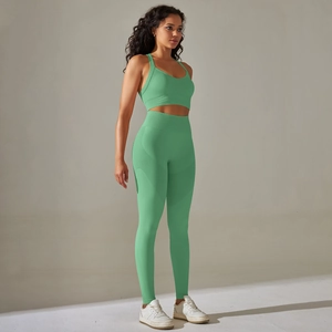 Detail of mint green seamless yoga set with high waist leggings and sports bra