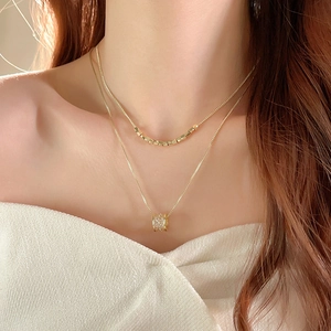 Double-layer 18k gold plated necklace with small gold beads and a sparkling zircon pendant