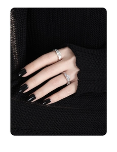 Close-up of S925 silver ring with irregular texture and white cubic zirconia accents