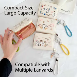 Cream PU leather wallet with cute cartoon cat illustrations and woven wrist strap