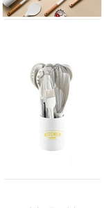 Detailed view of heat-resistant silicone kitchen utensils with wooden handles in holder