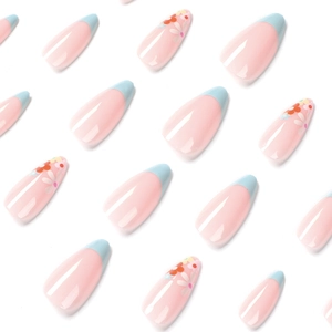 Almond press on nails with blue French tips and small floral daisy patterns