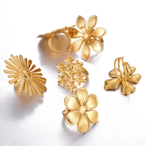 Elegant gold titanium steel flower rings set with zircon accents for women in various floral designs