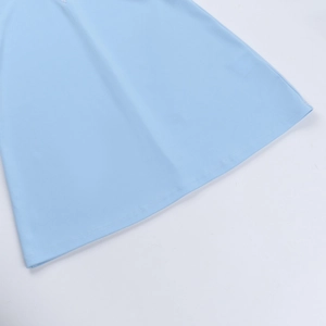 Detail view of the light blue dress hem featuring clean double-needle stitching quality