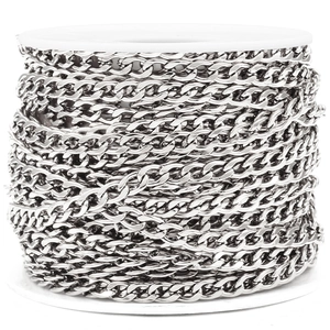 Silver stainless steel NK curb chain on white spool for DIY jewelry making and crafts