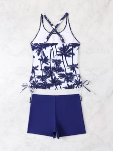 Detail view of tropical palm tree print tankini top with crisscross back and side drawstrings