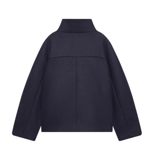Rear view of navy wool jacket featuring standing collar and loose casual silhouette
