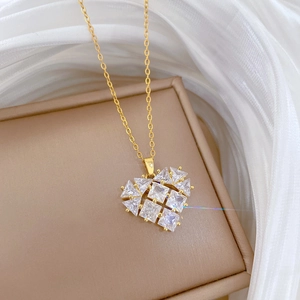 Close-up of heart pendant necklace with square and triangular cubic zirconia crystals