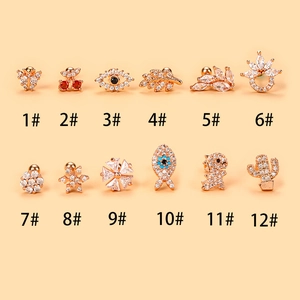 Collection of 12 gold plated surgical steel stud earrings featuring zircon animal shapes