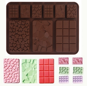 Macro view of silicone chocolate mold with heart, grid, and crackle pattern textures