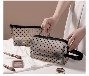 Detail of heart pattern mesh makeup bags with zip closure and convenient side handle
