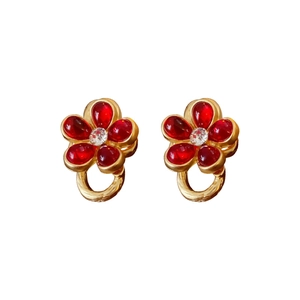 Vintage gold metal flower earrings with red crystal petals and clear center stone