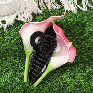 Calla lily claw clip with pink flowers on green grass background for women