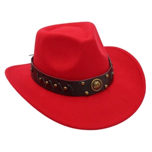 Detail view of red western cowboy hat with a metal horseshoe badge on black leather band