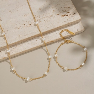 Elegant 18K gold plated stainless steel necklace and bracelet set with freshwater pearls