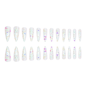 Macro detail of long stiletto press-on nails with multi-color glitter and sequins
