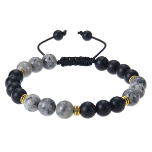 Detailed close-up of 8mm matte stones and marble beads with gold spacers on braided cord