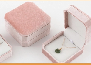 Detail view of pink velvet octagonal jewelry box with inner necklace holder
