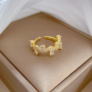 Close-up of gold adjustable twig ring with cubic zirconia in a jewelry box setting