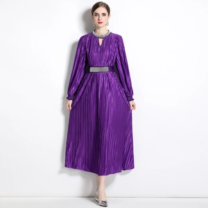 Elegant purple pleated maxi dress with beaded silver trim and long sleeves for evening wear