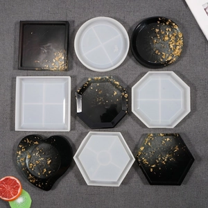 DIY silicone molds for resin coasters in hexagon, square, and heart shapes with gold foil